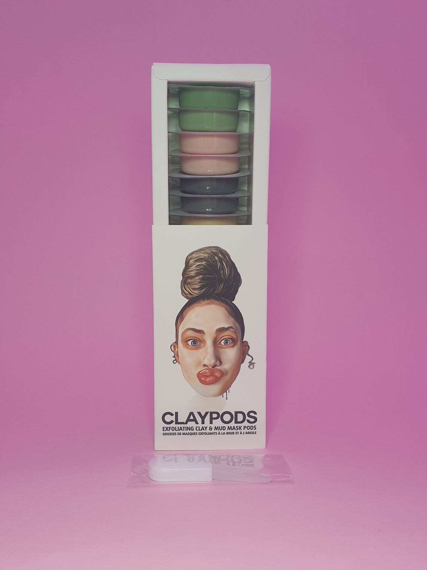 mixed clay pods with mud mask brush