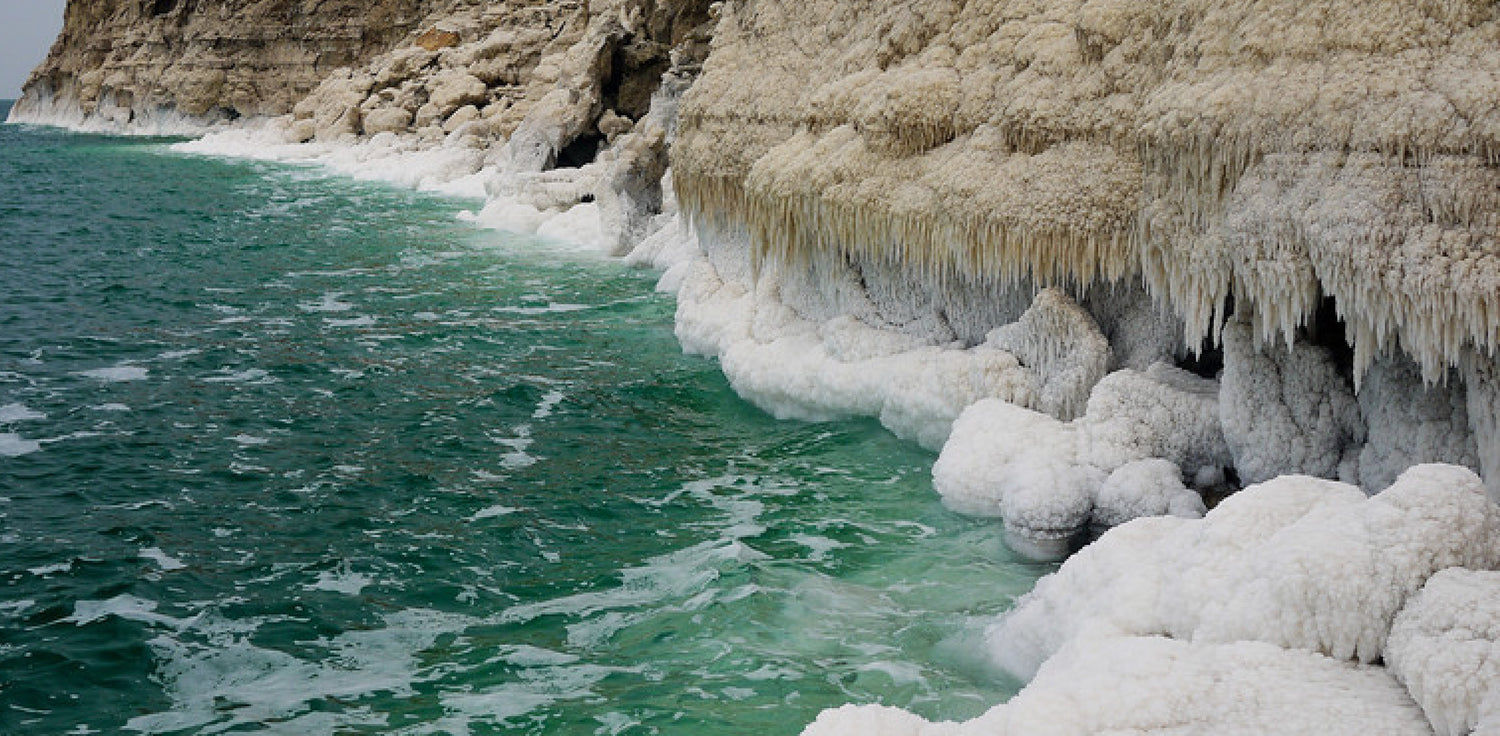 Dead Sea clay - A photo of a natural clay sourced from the Dead Sea region, which is located between Jordan and Israel. This grayish-green clay is rich in minerals and is commonly used in skincare products for its detoxifying and purifying properties. Dead Sea clay can help to absorb excess oil, remove impurities, and improve the overall appearance of the skin.