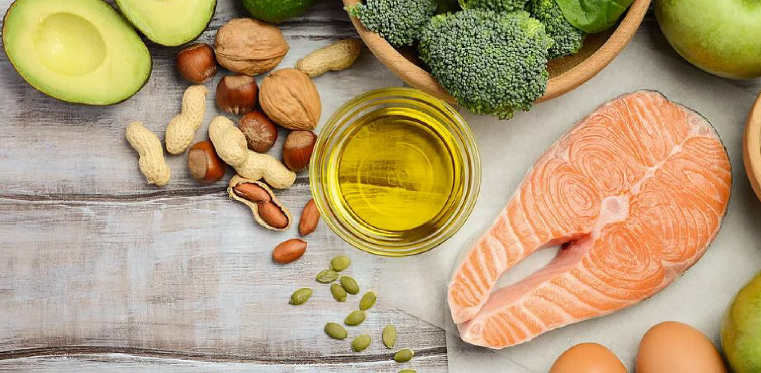 Omega-rich food - A photo of a plate with various foods that are rich in omega fatty acids. The plate includes fish, nuts, seeds, avocados, and leafy green vegetables. The image conveys the concept of omega-rich foods, which are known for their health benefits and are associated with heart health, brain function, and overall well-being.