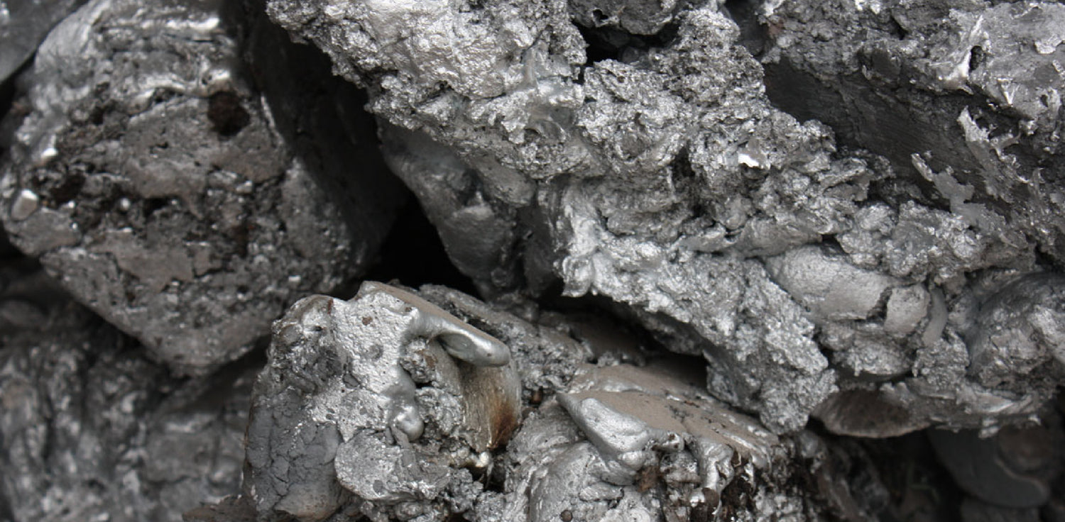 Zinc - A bluish-white, metallic element with a shiny appearance. It has a solid, dense, and brittle texture. Zinc is commonly found in the form of metallic pellets, sheets, or powders. It has a distinct metallic luster and can appear shiny and reflective when freshly polished. In its natural state, zinc has a silvery-gray color, but it can develop a dull gray or dull blue-gray patina when exposed to air and moisture.